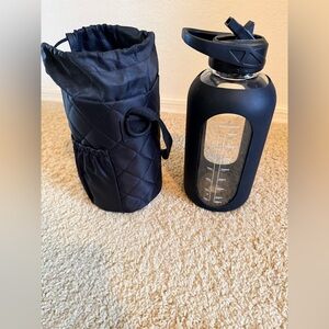 Black Glass Water Bottle with Insulated Quilted Sleeve with a Pocket